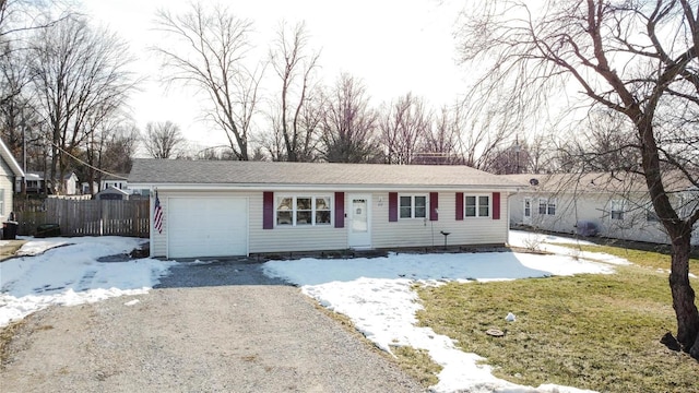 single story home with a garage and a yard