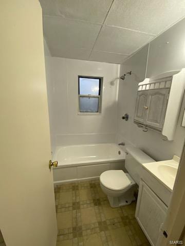 full bathroom featuring vanity, a paneled ceiling,  shower combination, and toilet