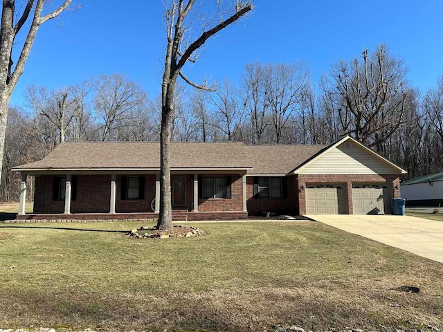 single story home featuring a garage, a porch, and a front lawn