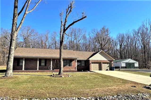 single story home with a garage and a front lawn