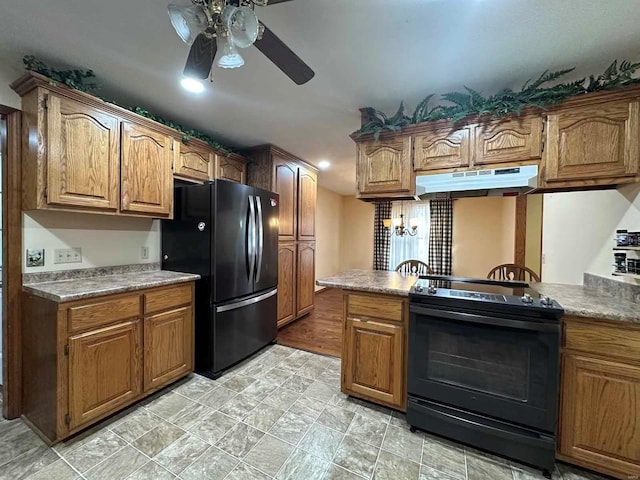 kitchen with black appliances, kitchen peninsula, and ceiling fan