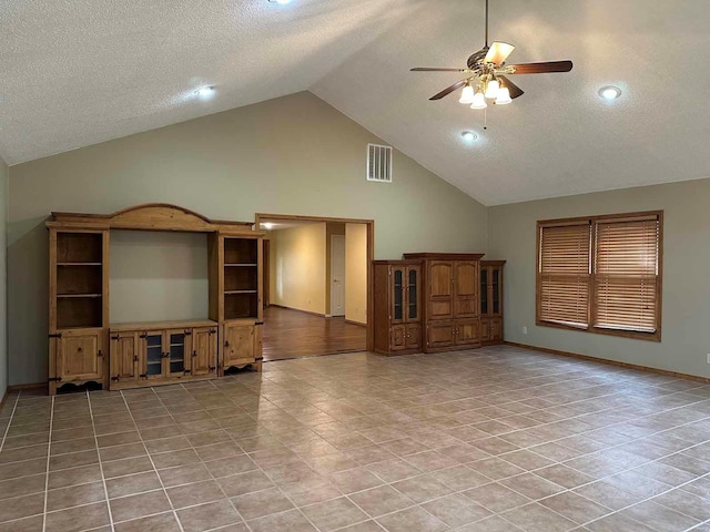 unfurnished living room featuring light tile patterned flooring, high vaulted ceiling, a textured ceiling, and ceiling fan