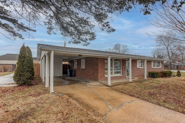 ranch-style house featuring a carport