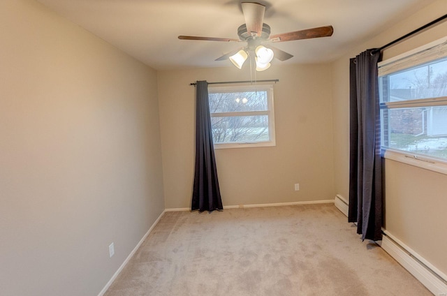 unfurnished room with ceiling fan, light colored carpet, and baseboard heating