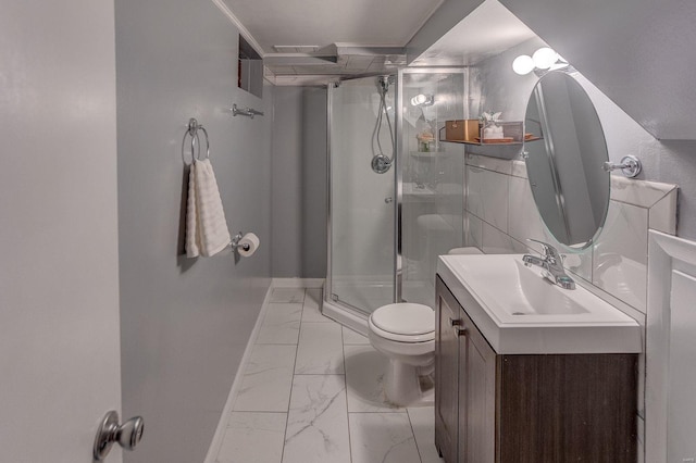 bathroom featuring vanity, toilet, and a shower with door