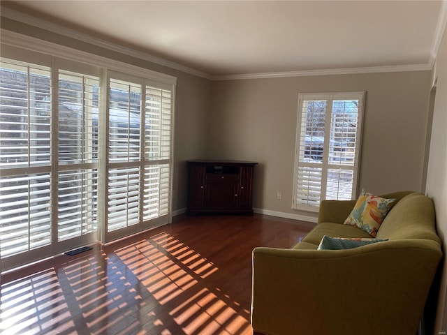 sitting room featuring dark hardwood / wood-style flooring and ornamental molding