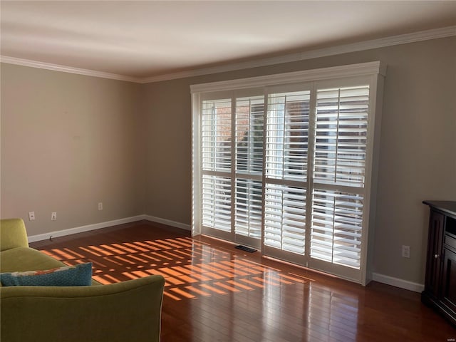 unfurnished living room with crown molding and dark wood-type flooring