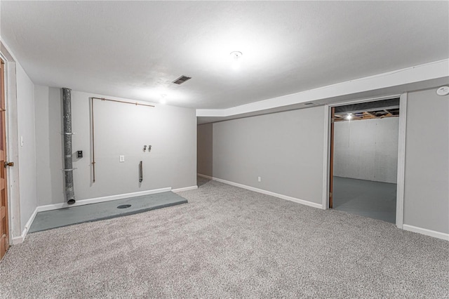 basement with carpet floors and a textured ceiling