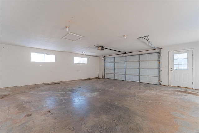 garage featuring a garage door opener