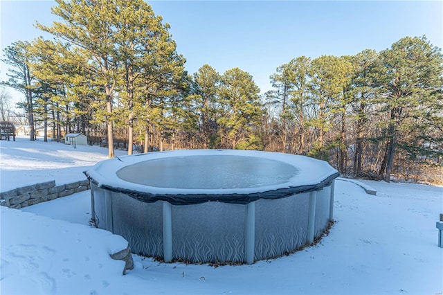 view of snow covered pool