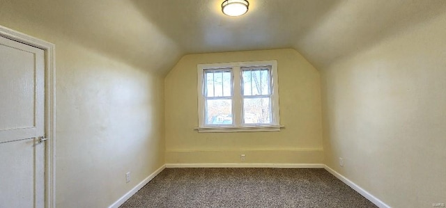 bonus room featuring carpet flooring and vaulted ceiling