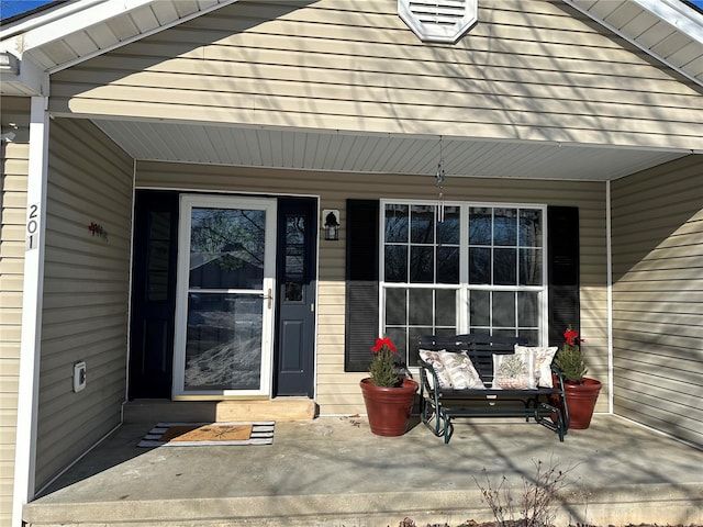 property entrance with covered porch