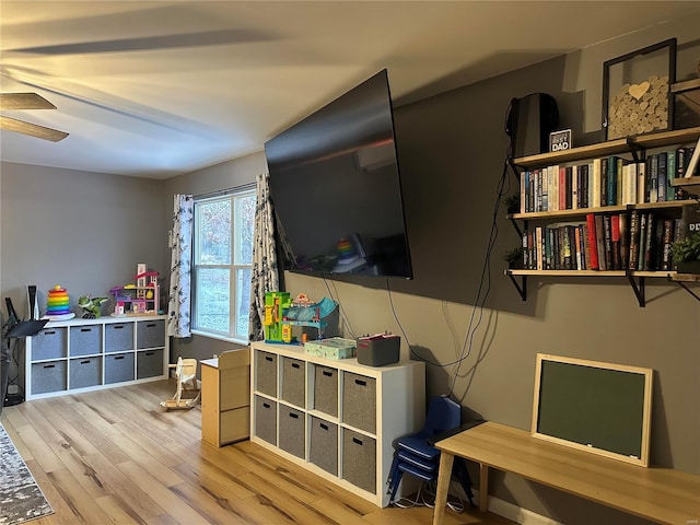 recreation room featuring ceiling fan and light wood-style floors