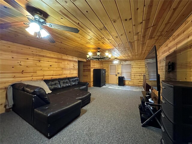 carpeted living area featuring wood walls, wood ceiling, and a ceiling fan