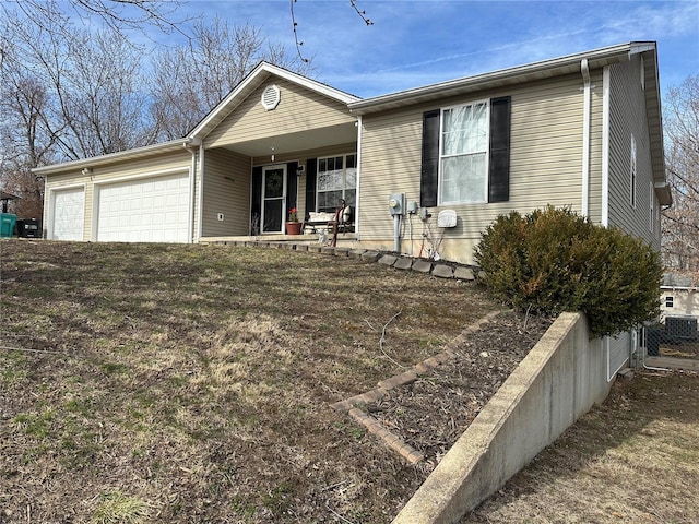 ranch-style house with fence and an attached garage