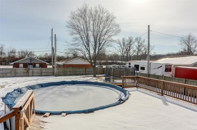 view of yard with a covered pool and a trampoline