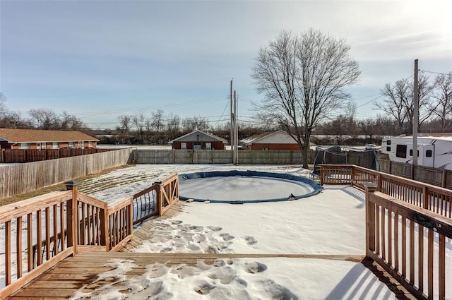 view of swimming pool featuring a wooden deck