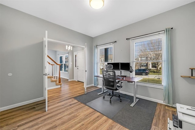 office with baseboards and wood finished floors