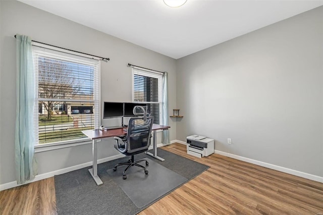 office featuring baseboards and wood finished floors