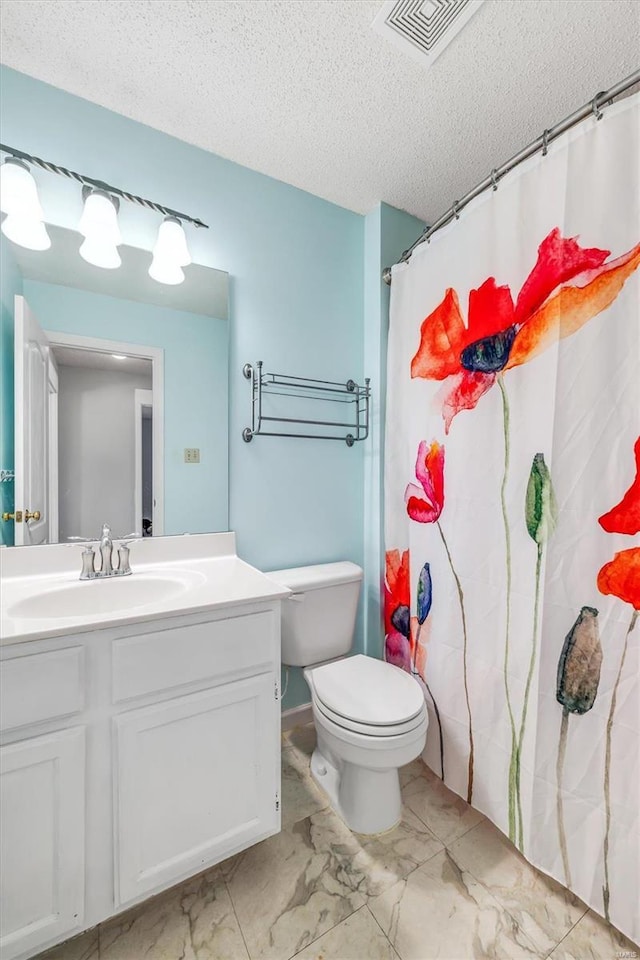 full bath with a textured ceiling, toilet, vanity, and visible vents