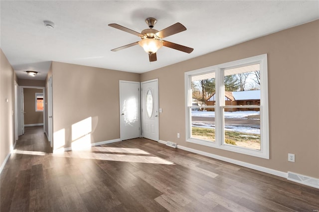 foyer entrance with hardwood / wood-style flooring and ceiling fan