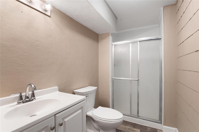 bathroom with walk in shower, vanity, toilet, and hardwood / wood-style flooring