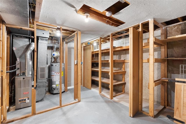 basement with heating unit and water heater