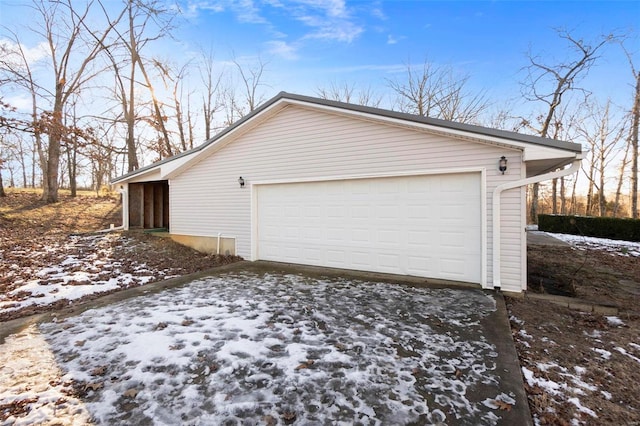 view of snow covered garage