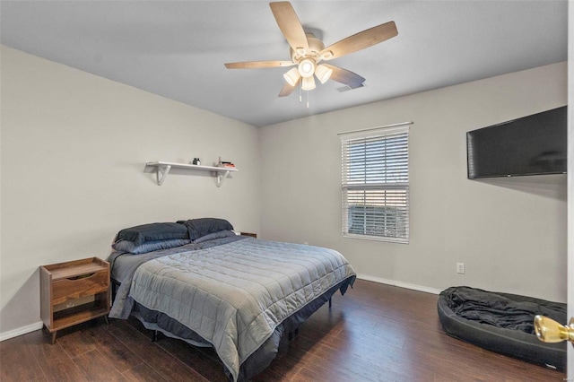 bedroom featuring dark wood-type flooring and ceiling fan