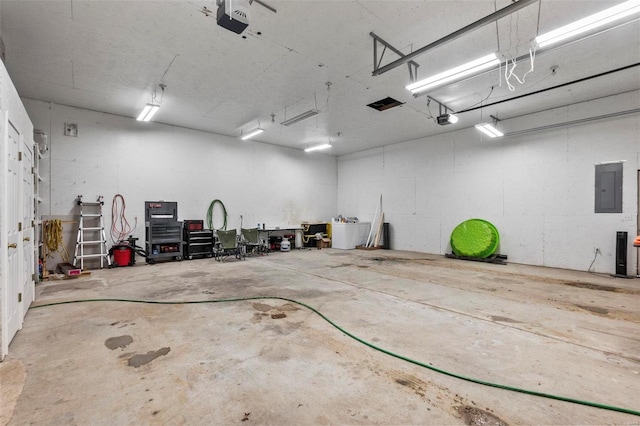 garage featuring a garage door opener and electric panel