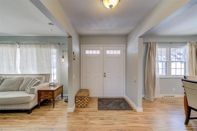 foyer entrance featuring light wood-type flooring