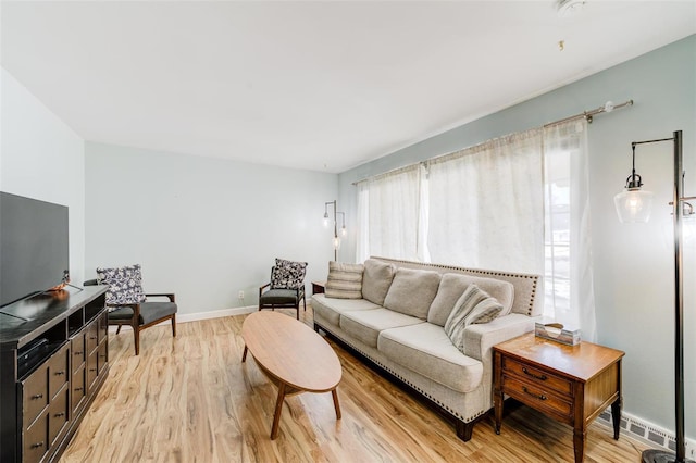 living room with light hardwood / wood-style flooring