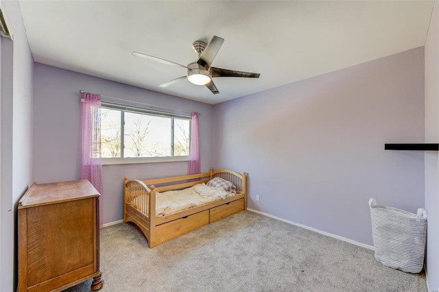 bedroom featuring light carpet and ceiling fan