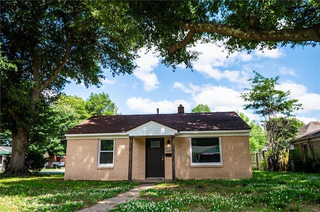 view of front of home with a front yard