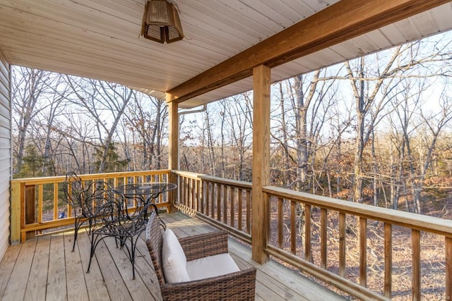 deck with outdoor dining area