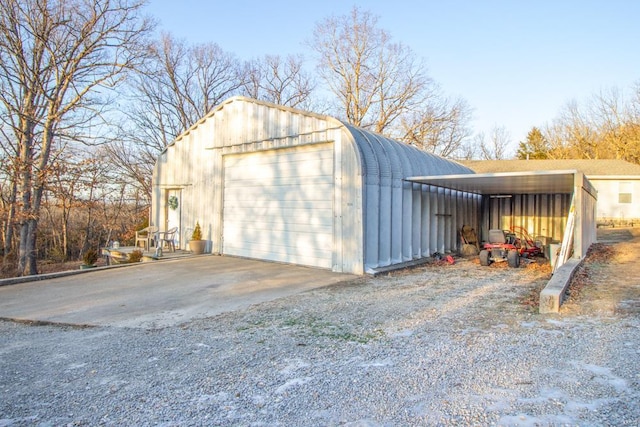 detached garage featuring driveway