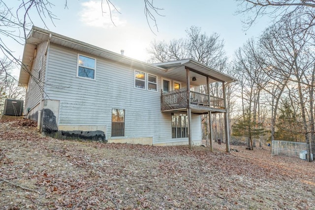 back of house featuring central AC unit