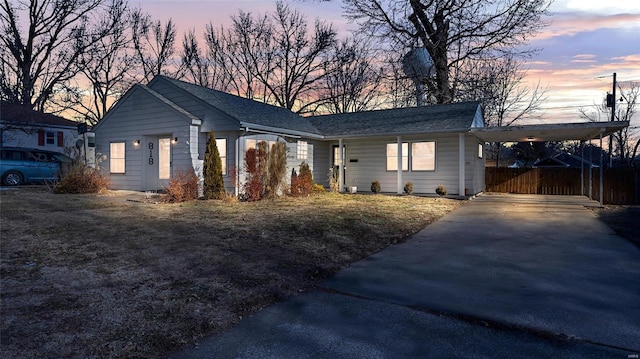 single story home featuring a carport