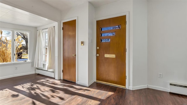 foyer featuring a baseboard radiator, dark hardwood / wood-style floors, and plenty of natural light