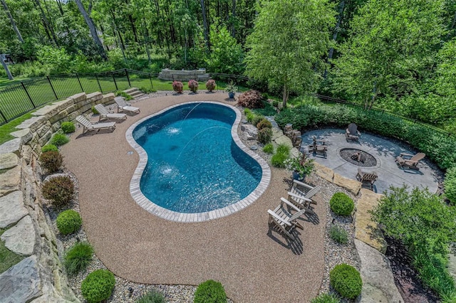 view of swimming pool featuring a patio area and an outdoor fire pit