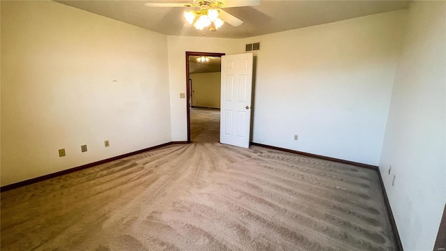 empty room featuring ceiling fan and carpet floors