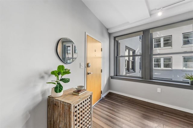 entryway featuring track lighting and hardwood / wood-style floors