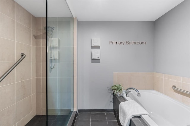 bathroom featuring tile patterned floors and shower with separate bathtub