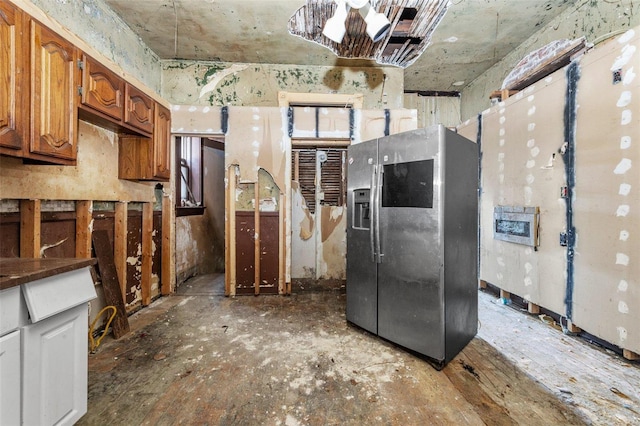 kitchen featuring stainless steel fridge with ice dispenser