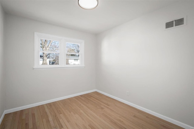 spare room with light hardwood / wood-style floors