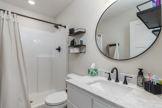 bathroom with vanity, toilet, and a shower with shower curtain