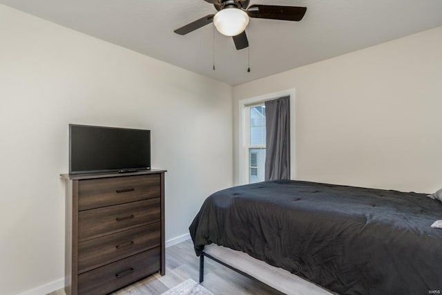 bedroom featuring ceiling fan and light hardwood / wood-style floors