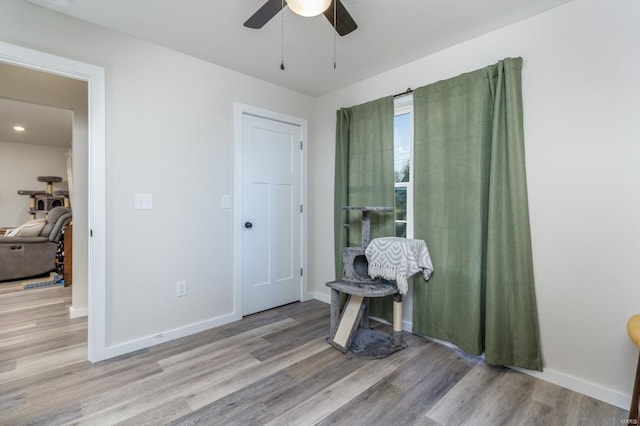 interior space with light hardwood / wood-style floors and ceiling fan