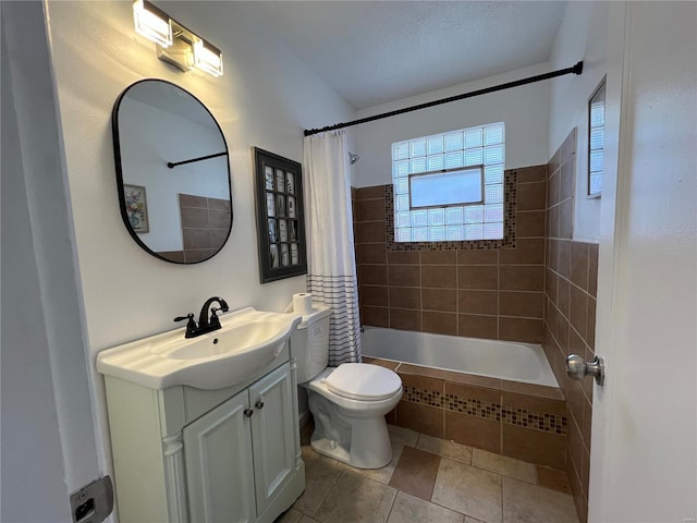 full bathroom with tile patterned flooring, vanity, shower / bath combination with curtain, and toilet