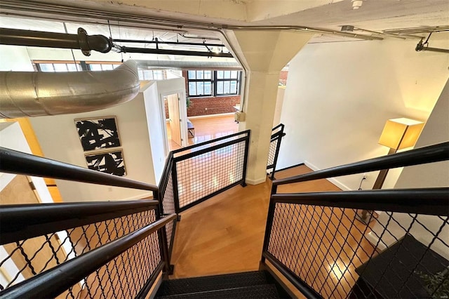 stairway featuring hardwood / wood-style floors